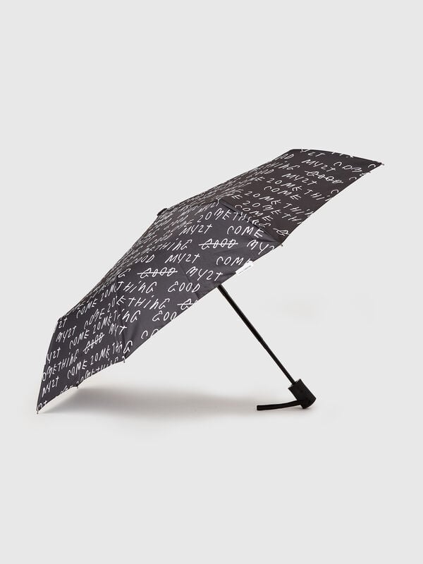 Black umbrella with Coco Capitán text